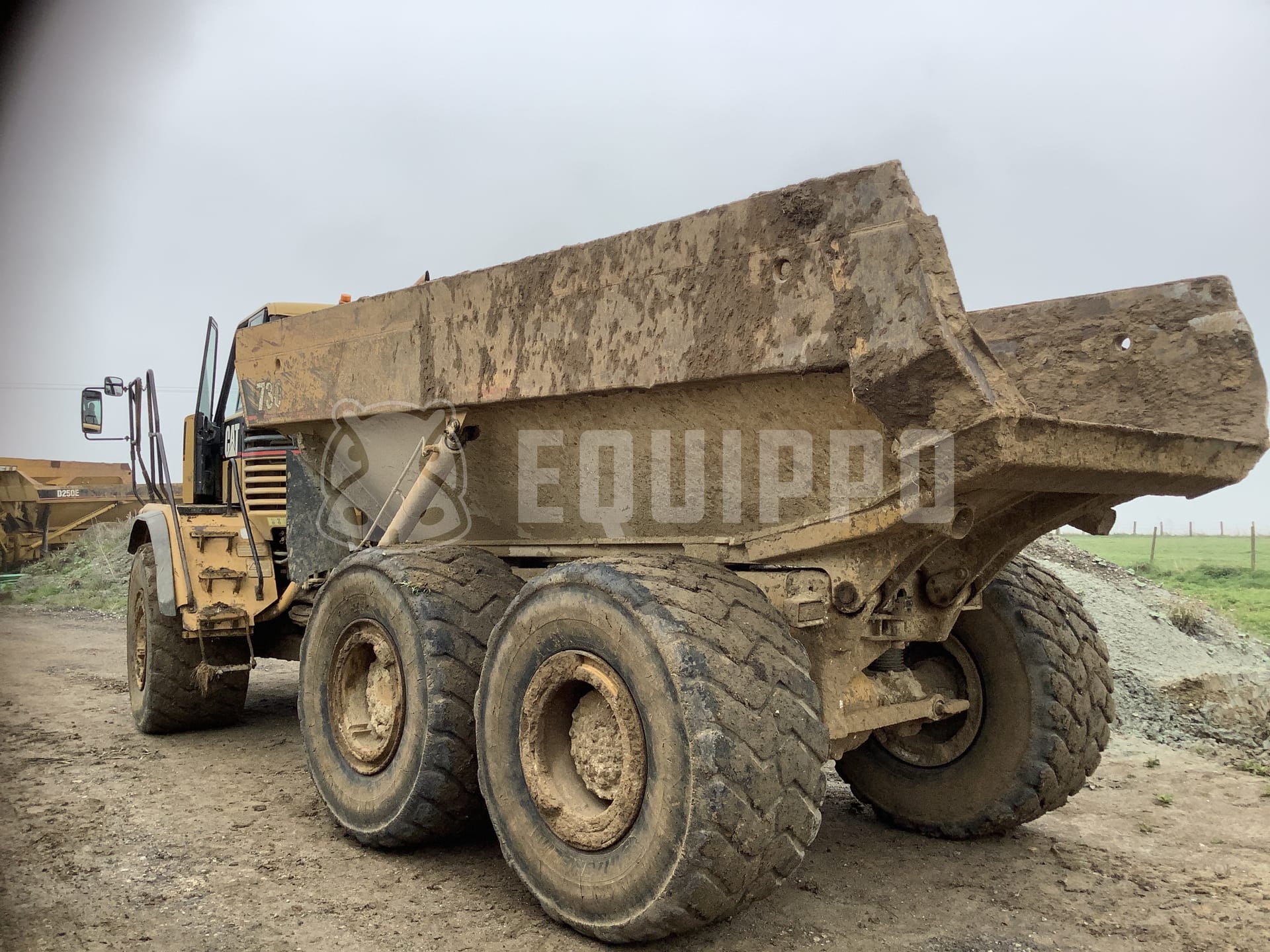 Caterpillar 725  - - Used Dump Truck