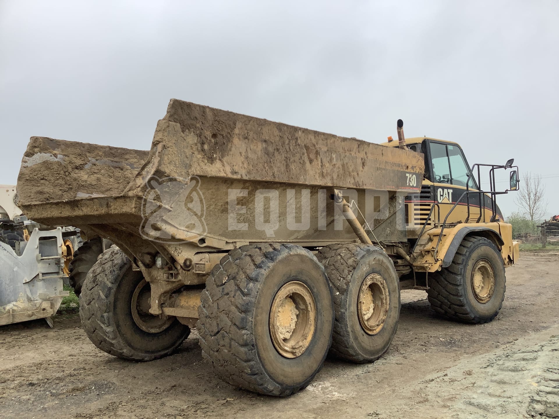 Caterpillar 725  - - Used Dump Truck