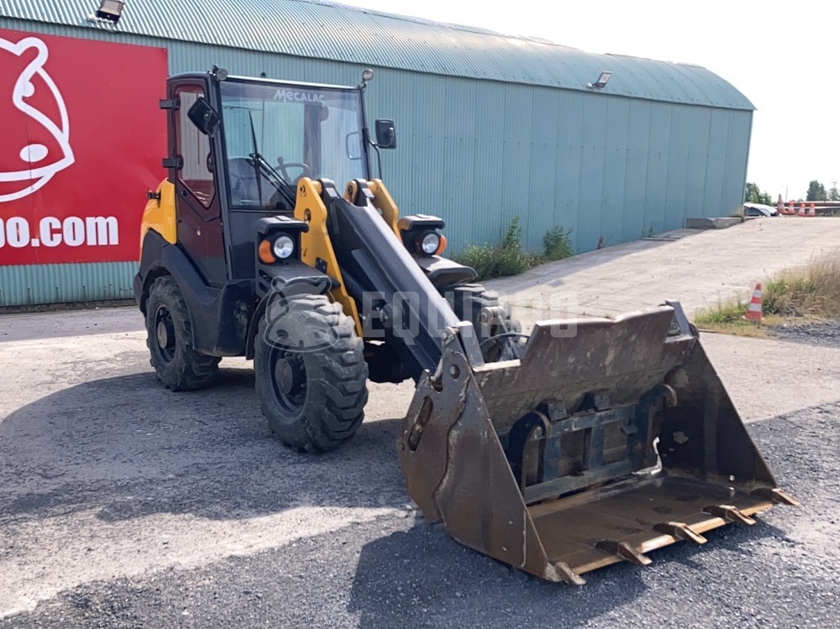 Mecalac AX700 with 4-in-1 bucket and forkboard - - Used Wheel Loader