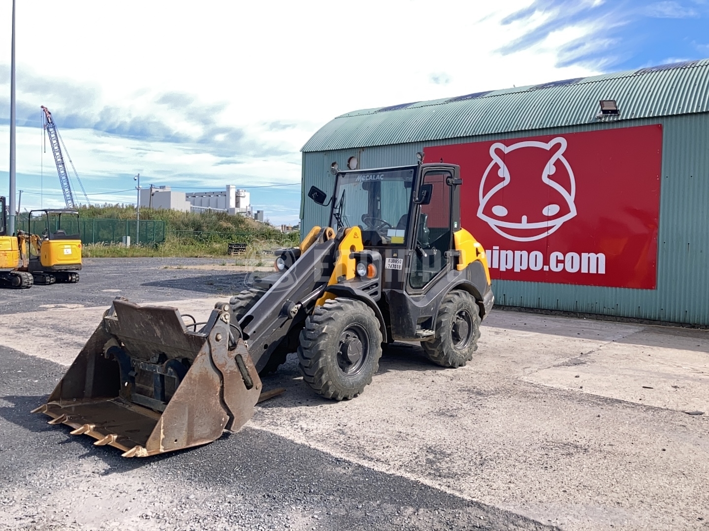 Mecalac AX700 with 4-in-1 bucket and forkboard - - Used Wheel Loader