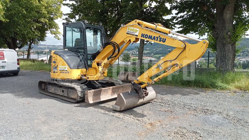 Komatsu PC55MR-5E0 z 3 łyżkami - Prawy Przód - Używany Mini koparka < 7t