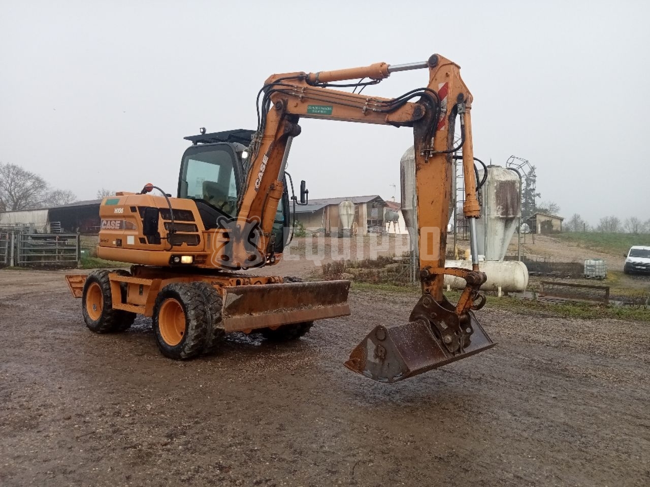 Case WX95 mit 4 Baggerlöffeln und Gabeln - - Gebrauchte  Mobilbagger