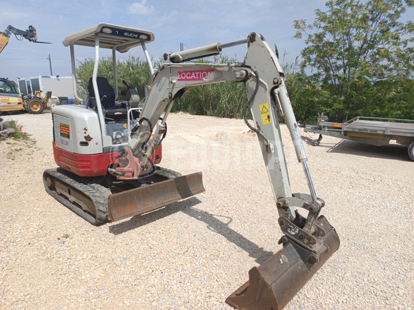 Picture of the Takeuchi TB23R with 3 excavator buckets
