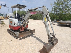 Picture of the Takeuchi TB23R with 3 excavator buckets