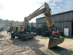 Photo de la Hydrema RB15-MX18 avec tiltrotator, attache rapide et godet d'excavatrice