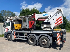 MAN TGS 26.320 6x2-2 BL mit Oil Steel Eagle 3526 (35m) - - Gebrauchte  LKW-montierte Hubarbeitsbühne