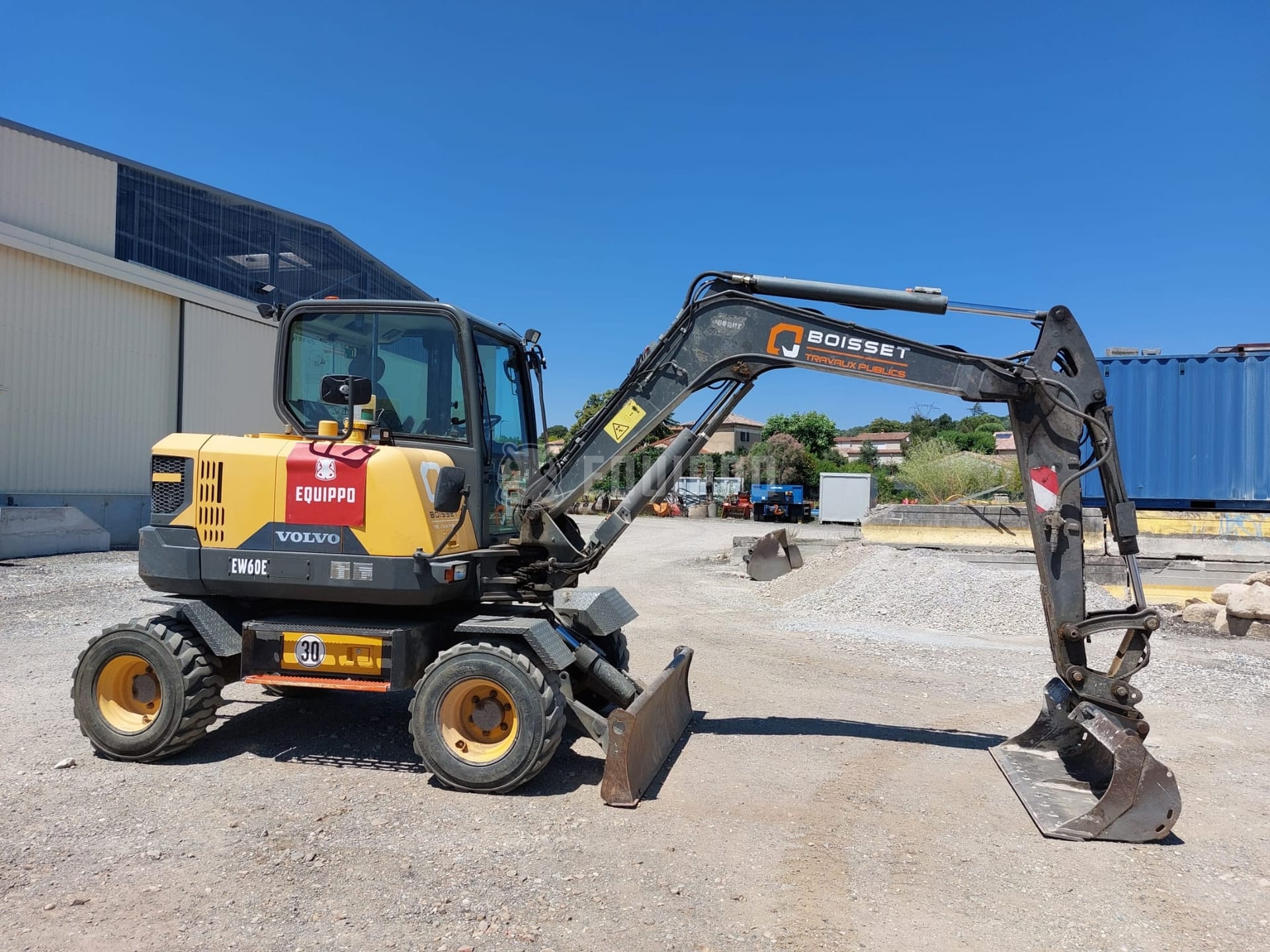 Volvo EW60E con 5 cazos - - Excavadora de ruedas Usada